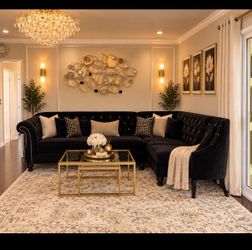Black sectional with Armani single chair