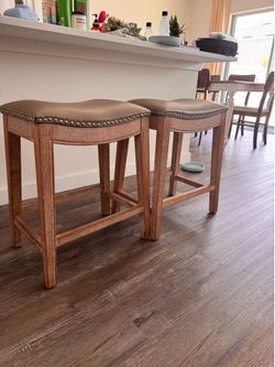Saddle-Seat Counter Stools — $25 each / $45 for the pair