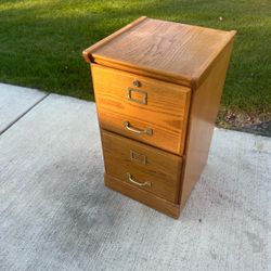 Wood 2 drawer filing cabinet with file folders and manila envelopes