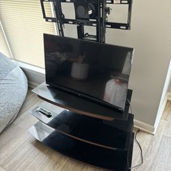 TV stand/entertainment Center And 29” TCL Roku TV