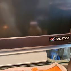 Sony 55 Inch T.V. with stand and Sony surround system.