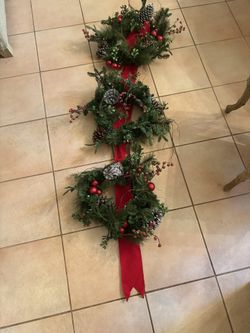 Three Wreath hanging Christmas decoration. Lights up.