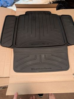 Black Rubber WeatherTech child car seat protector is made of high-density TPE material and features anti-skid surfaces to protect upholstery from spil