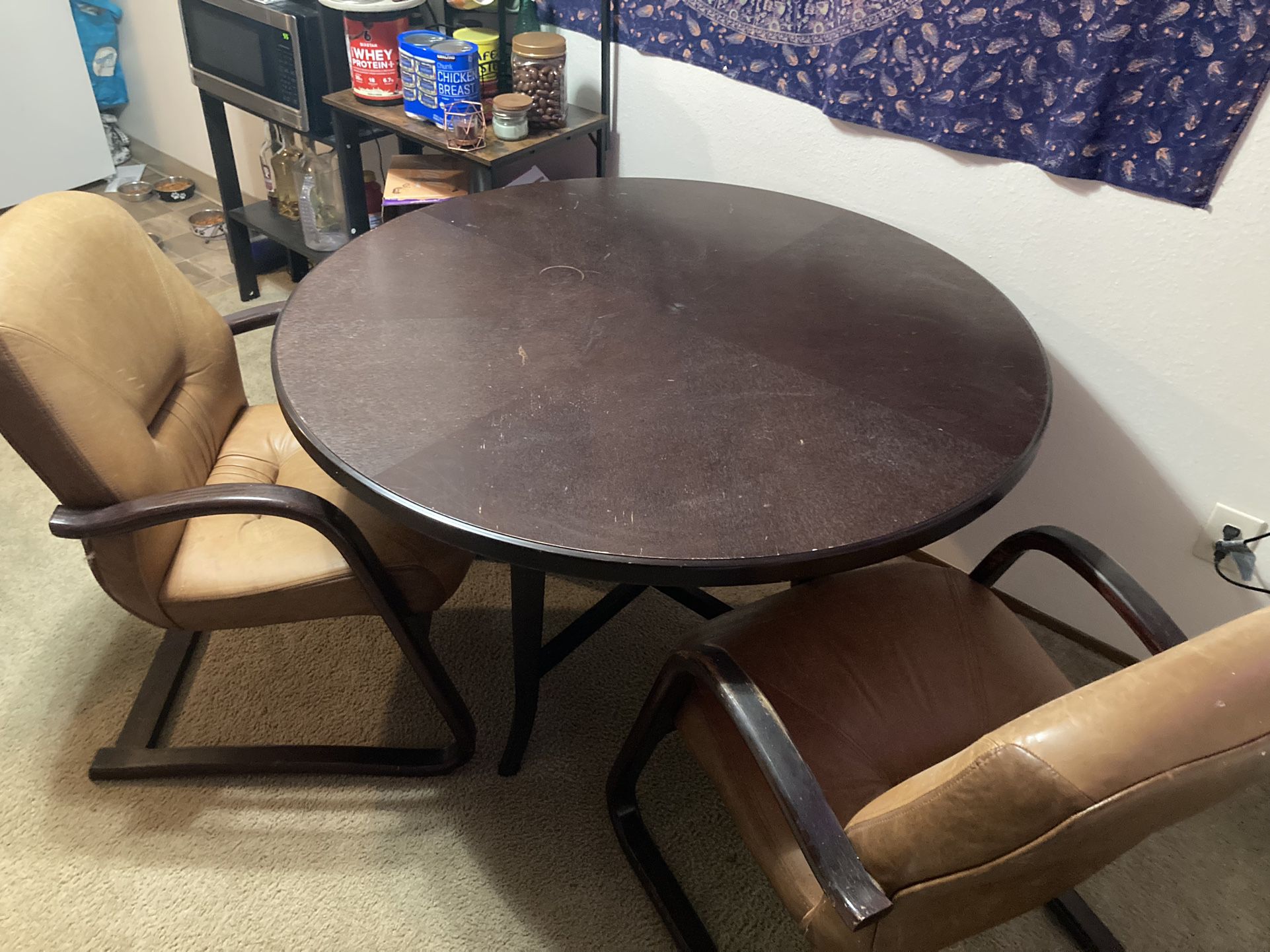 Round Table And leather Chairs