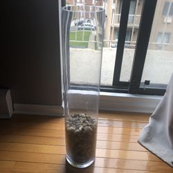 Glass decorative vase with rocks