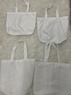 4 white tote bags from Micheal’s/ can be printed on
