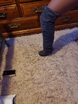 In Gently used condition gray knee high boots