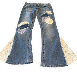 Reworked Upcycled Womens Jeans Low Rise Flair Bottom Boho Hippie Vibe Size 9/10  This product is a pair of women's jeans in size 9/10, with a high ri