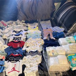 Newborn Clothes And Diapers 