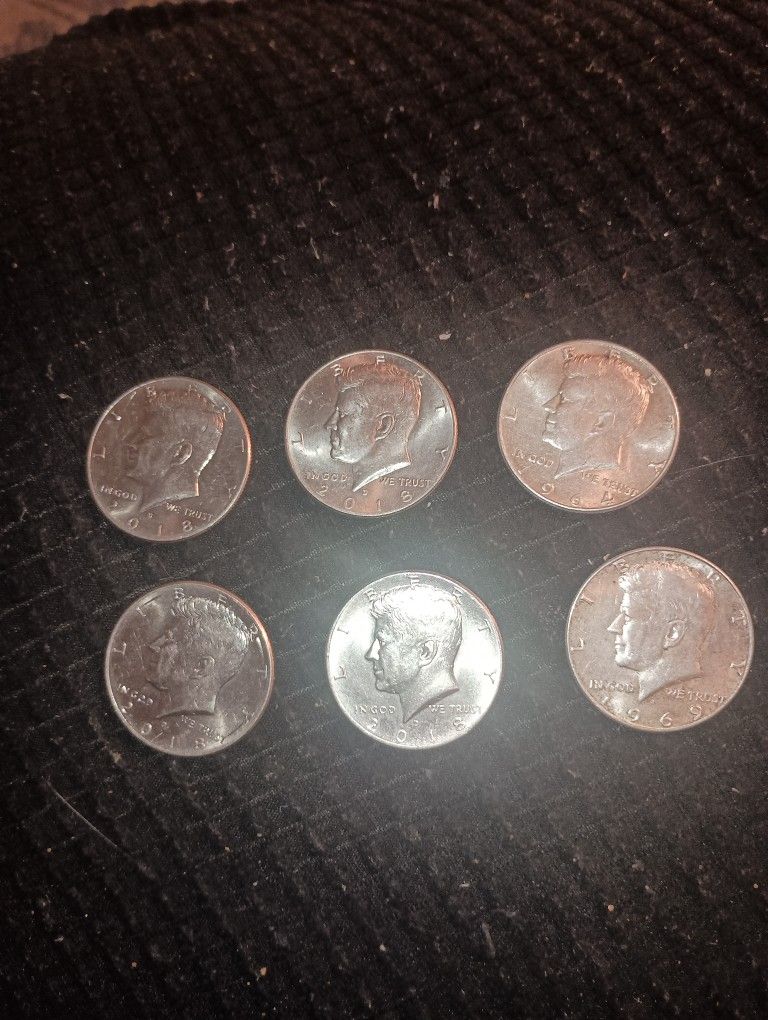 Six Kennedy Half Dollars. 