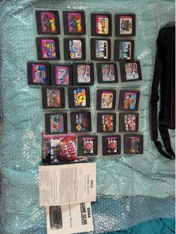 Sega game gear console with games and accessories