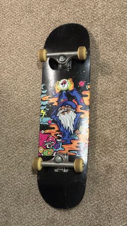 Skateboard with Wizard Graphic