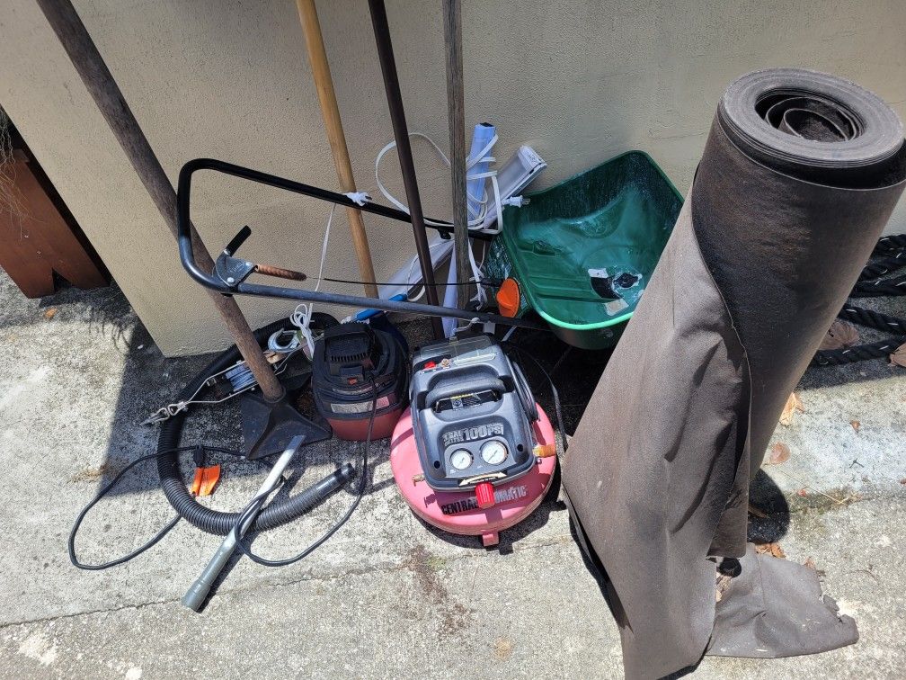 Cleaning out shed everything pictured wetvac,air compressor various lawn items roll of tar paper