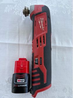 Milwaukee M12 multi tool, battery and charger