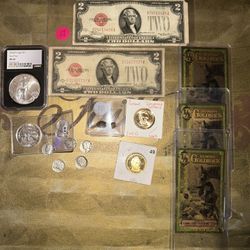 A lot of silver mixed with paper notes and gold bags A lot of silver mixed with paper notes and gold bags