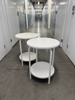 2  white metal nightstands