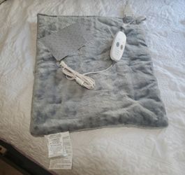 Massaging weighted heat pad