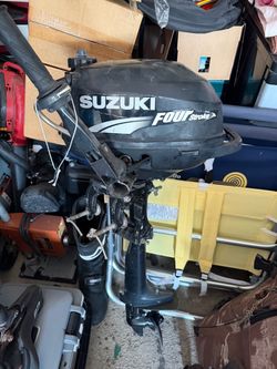 Lightweight and portable 2006 Suzuki 2.5 HP four-stroke outboard motor (Model DF2.5, Serial: 00251F-680141).