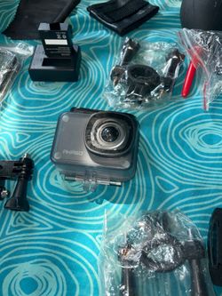 New, never used Akaso GoPro camera. Also included is a selfie stick with a small remote control and various accessories. HD image quality and waterpro