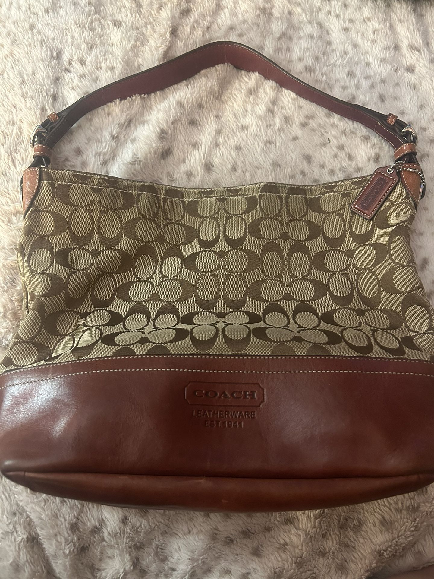 Brown authentic original COACH bag with leather bottom