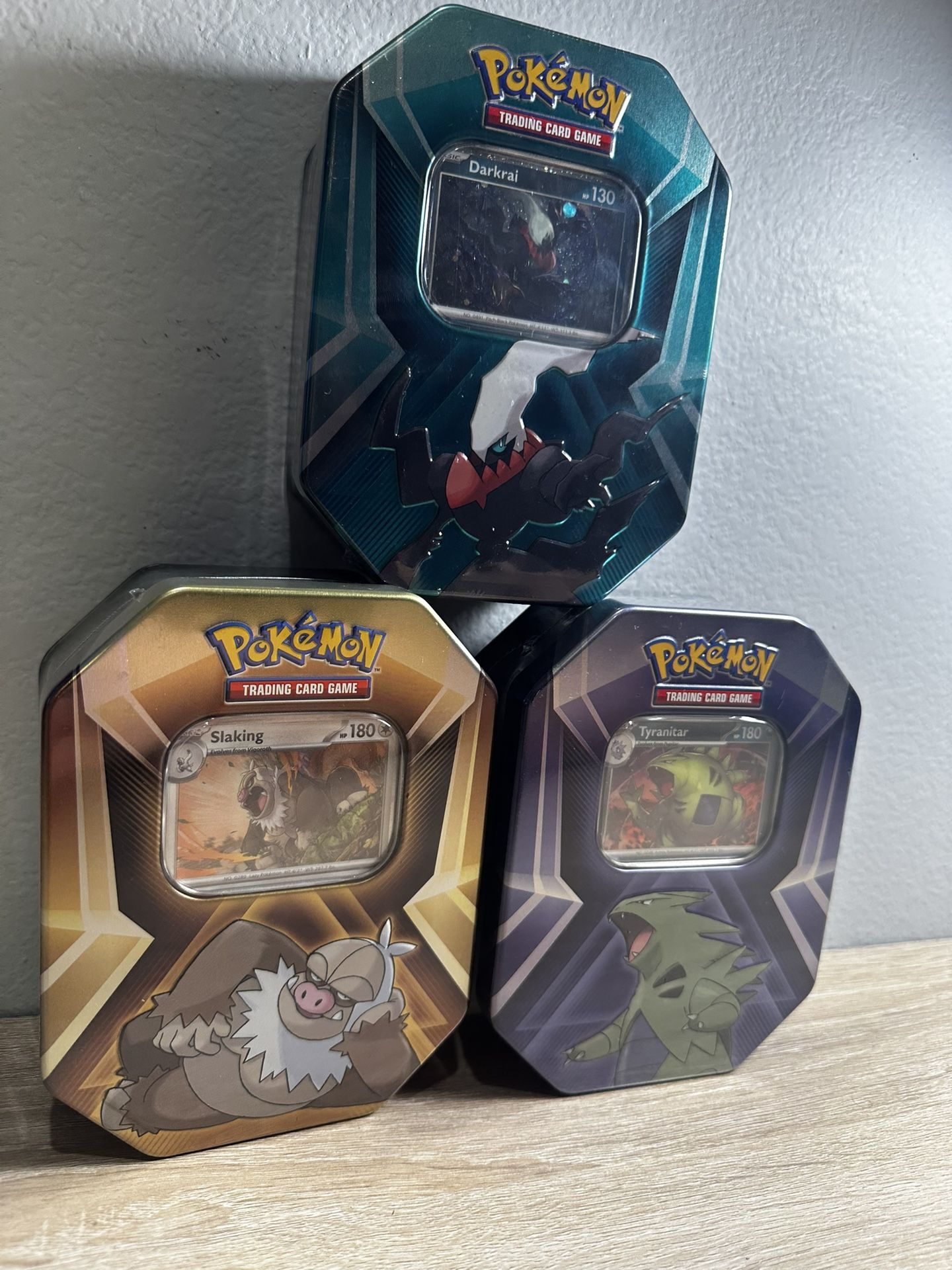 The Pokémon TCG: Triple Whammy Tin - Tyranitar, Slaking, Darkrai (3 Tins)