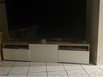 Free TV stand (tv in image 75 inches)