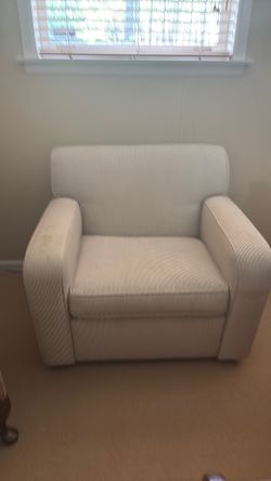 Comfy chair that was reupholstered. Has a few spots on arms that should come off.