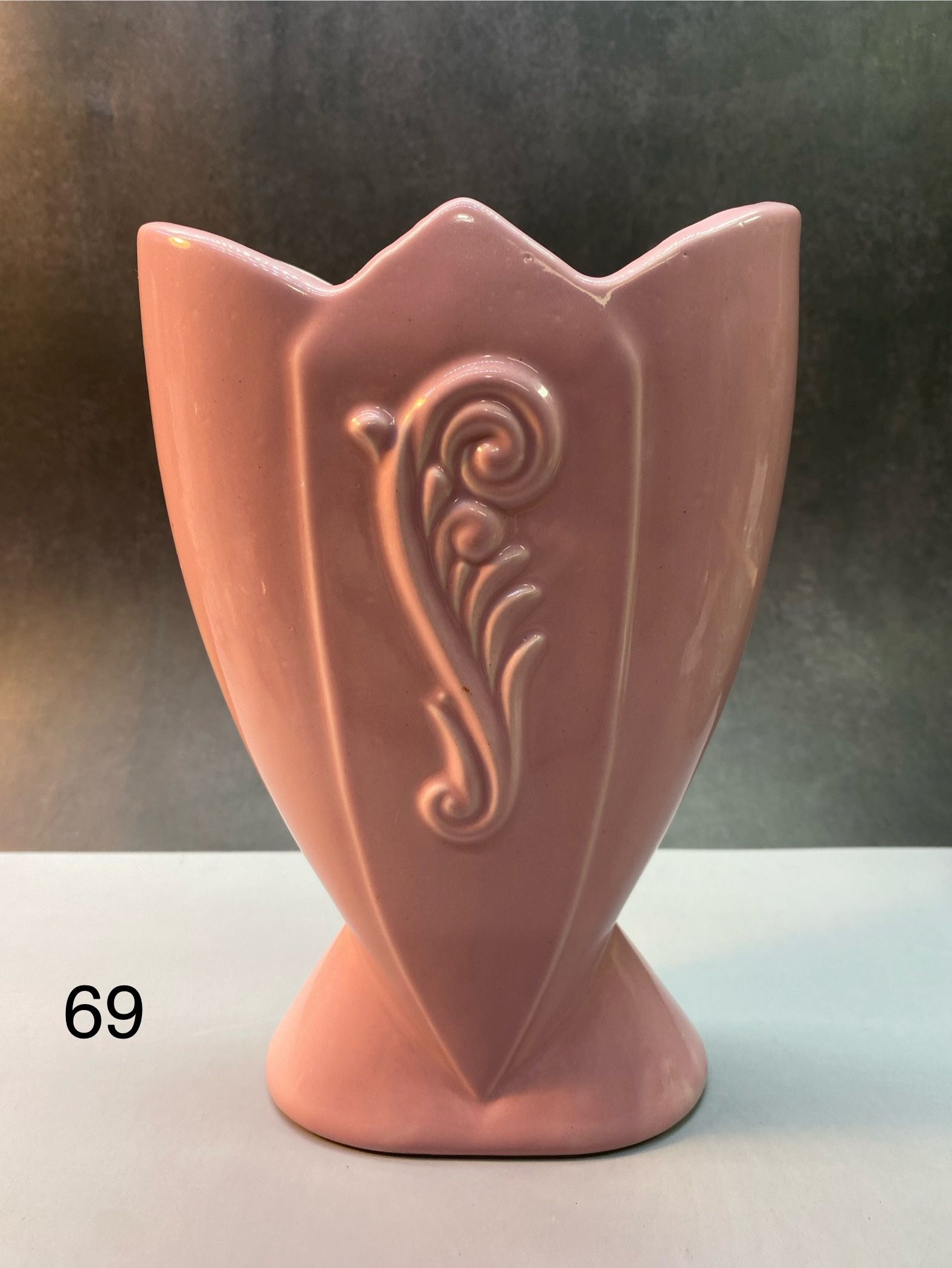 Fredericksburg Pottery pink fan vase, likely from the 1940s, featuring an Art Deco style and an embossed floral or scroll design.