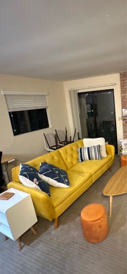 Yellow futon couch (pillows not included)