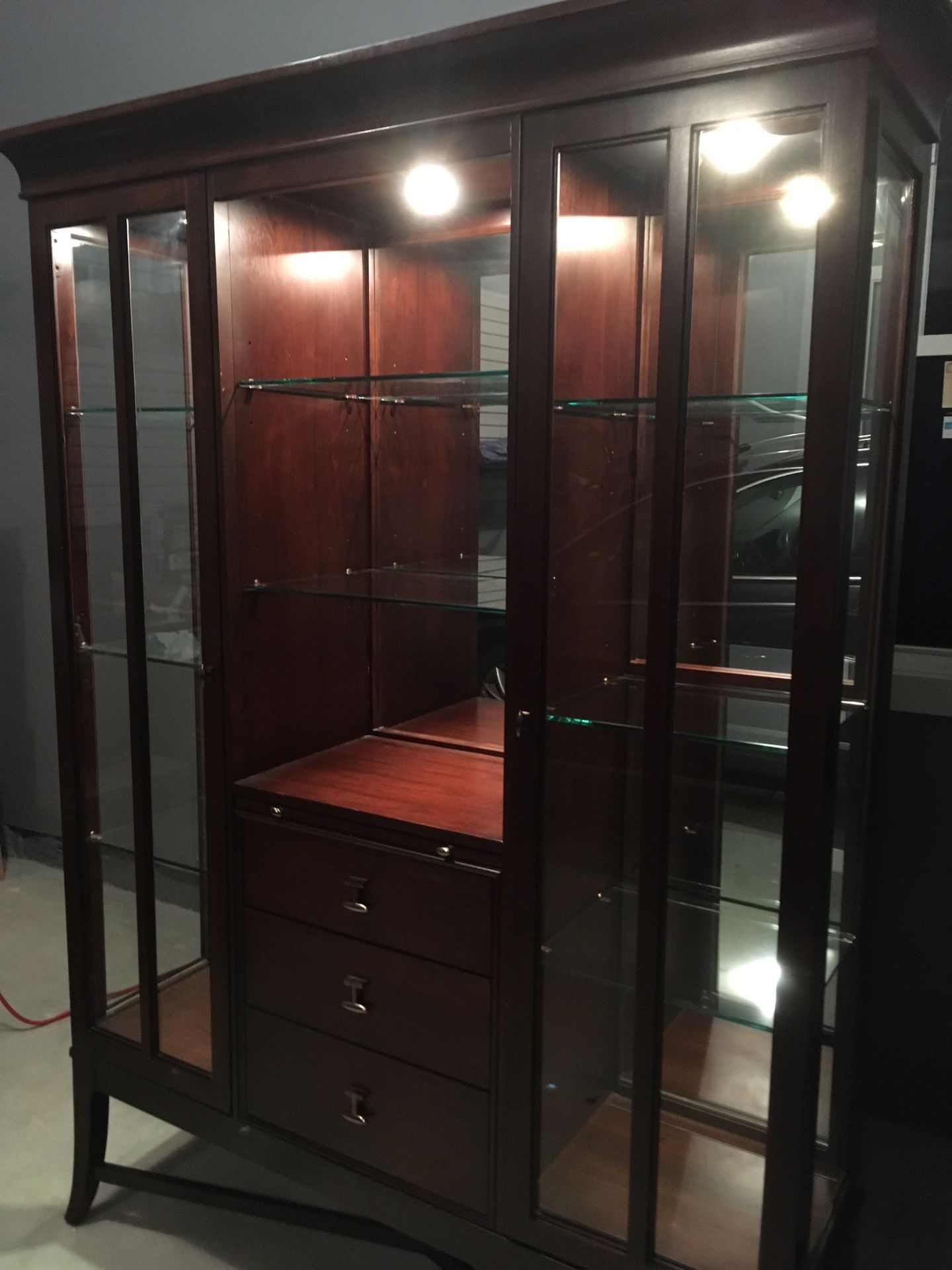 Display cabinet with fold out desk
