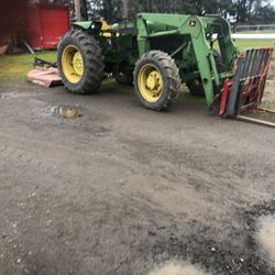 John Deere 2355M4WD loader with bucket and forks