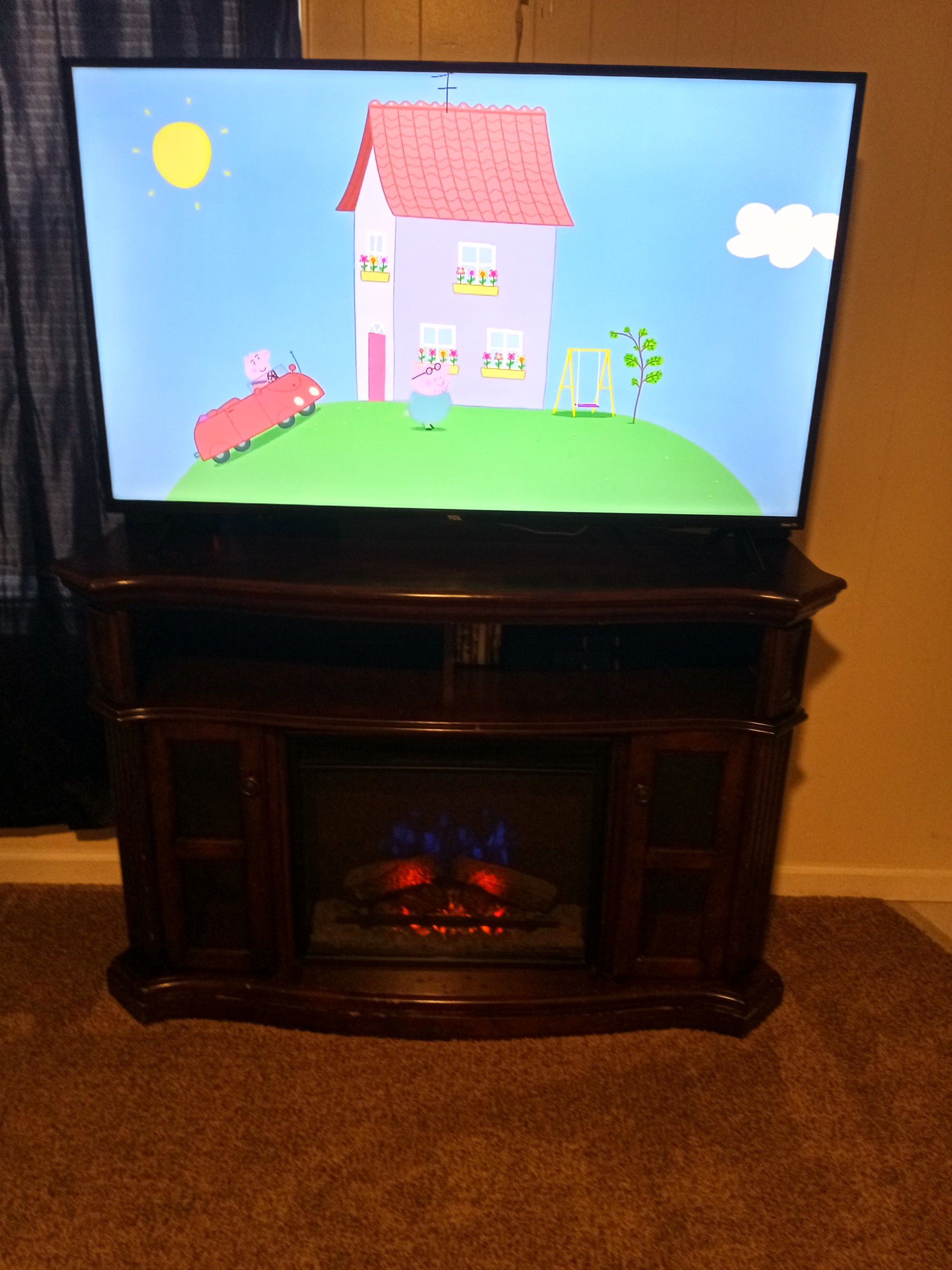 FIREPLACE TV STAND AND 55 INCH TCL SMART FLAT SCREEN TV