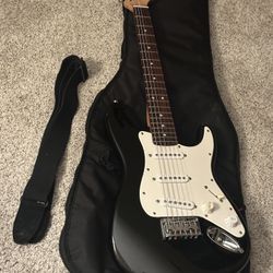 Fender Squier MINI electric guitar with case and strap