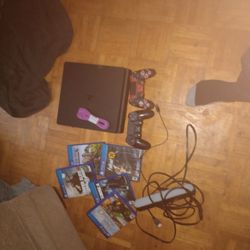 PS4 Slim With One New Controller And One Used Console In Good Condition Comes With 5 Games And More. Comes With A Led Light Bar With It And All It's W