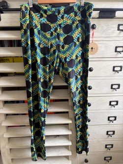 LuLaRoe TC Disney Leggings Minnie Mouse heads on a blue, yellow, and green vibrant background