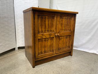 Rustic Wooden Cabinet with Dark Stud Detailing