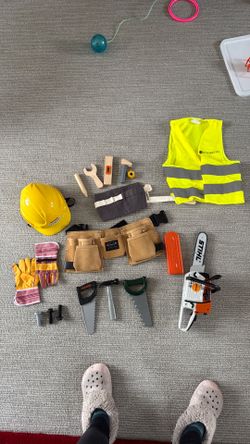 Kids construction worker gear and chainsaw