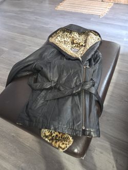 Leather winter jacket, black size medium with leopard print inside.  Made  by Wilson's Leather.