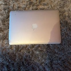 Macbook Air (2017) with charger cable