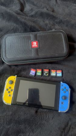 Nintendo switch with case and 5 games