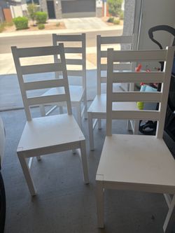 White wooden farmhouse style chairs