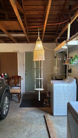 White macramé lamp with three shelves