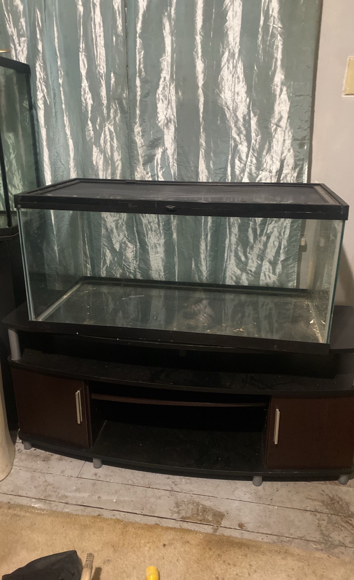 Two Tanks One With A Stand Other Locks