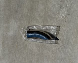 MBRP T5081 Exhaust Tip Polished chrome exhaust tip with a curved design and high-gloss finish