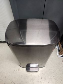 Metal step on trash or garbage can