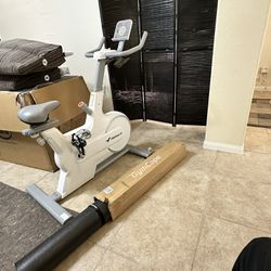 Like New Merach Exercise Bike with Bluetooth & New Bike Mat for Floor