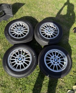 Set of four 15" OEM BMW wheels with Yokohama Avid Tires brand New Tires