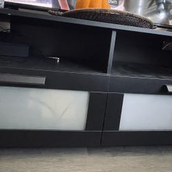 TV Stand with storage  (good condition still)
