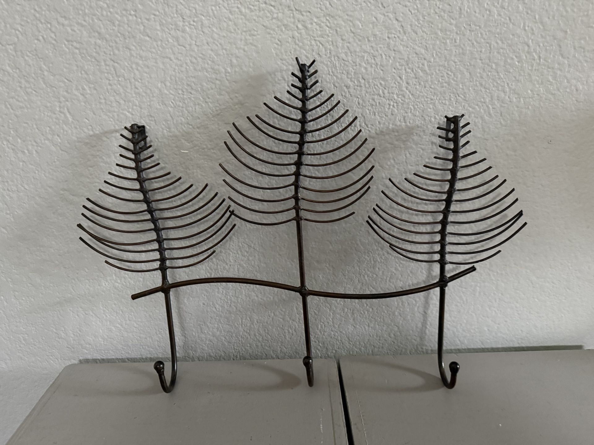 Decorative metal wall rack