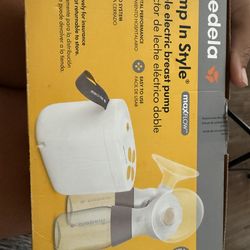 Breast pump with portable charge and extra pieces